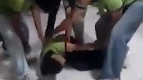 In the image a group of student is shown hurting one student in Allen coaching center