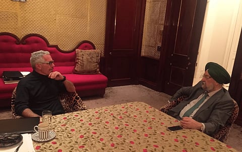 Image of petroleum minister hardeep singh puri and sex offender jeffrey epstein sitting across a table