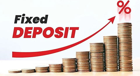 “Fixed Deposit” text beside ascending stacks of coins and a red upward arrow ending at a percent symbol, suggesting growing returns and a positive investment outlook.