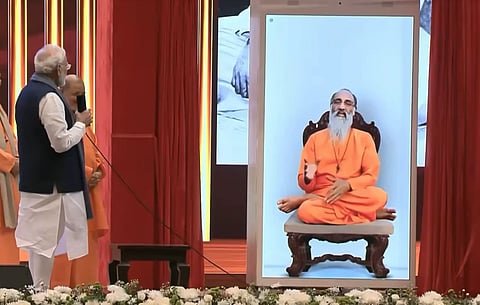 Image of PM Modi interacting with Swami Chinmayananda's AI bot