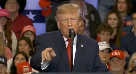 In the image Trump is shown addressing Americans