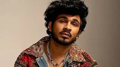 Singer Sanju Rathod posing for the camera in a vivid attire
