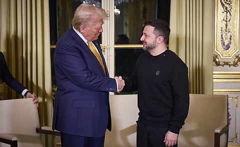 Trump shaking hands with ukrainian president Zelenskyy in paris