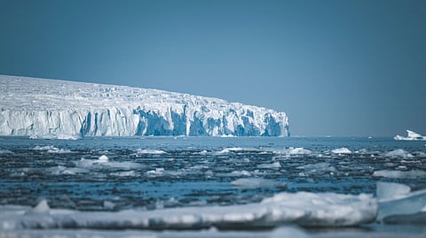 Representational image of Tourists and expedition guides in Antarctica surrounded by glaciers and penguin colonies amid concerns over climate change and cruise tourism