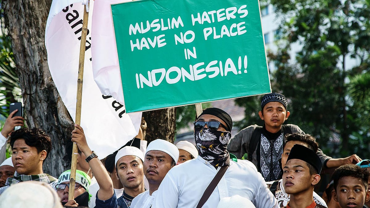 Indonesian protesters demand that Governor Basuki Tjahaja Purnama of Jakarta be arrested for blasphemy.