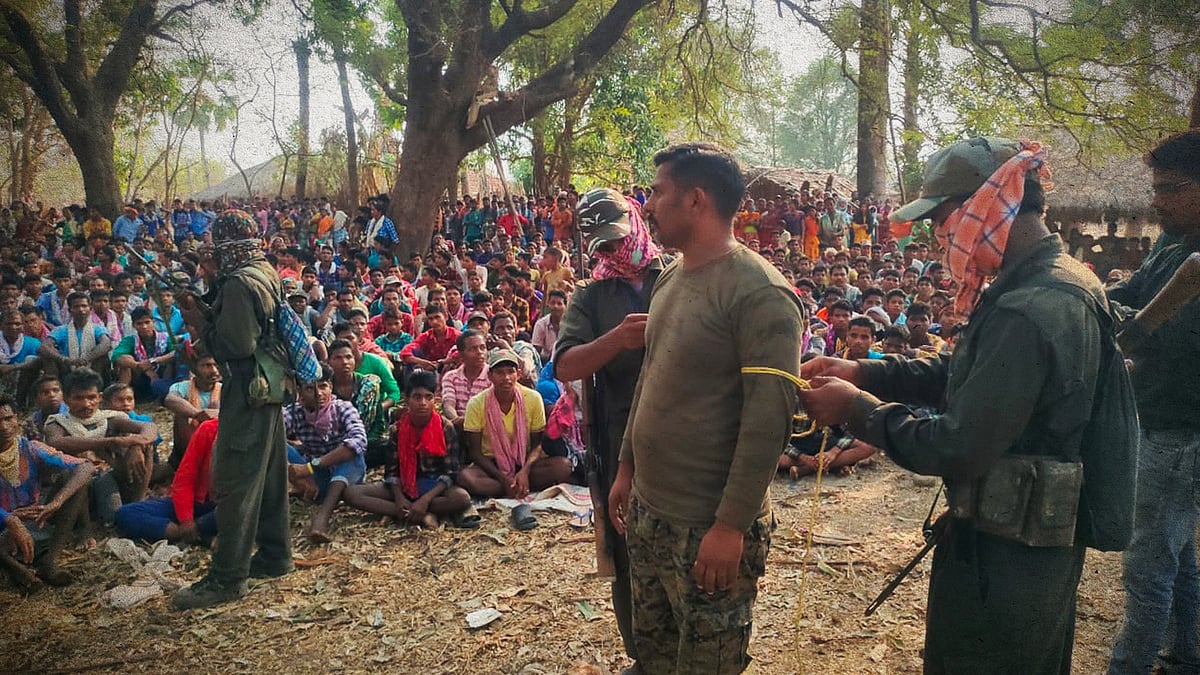 Manhas being untied by Maoists before being handed over to the delegation.