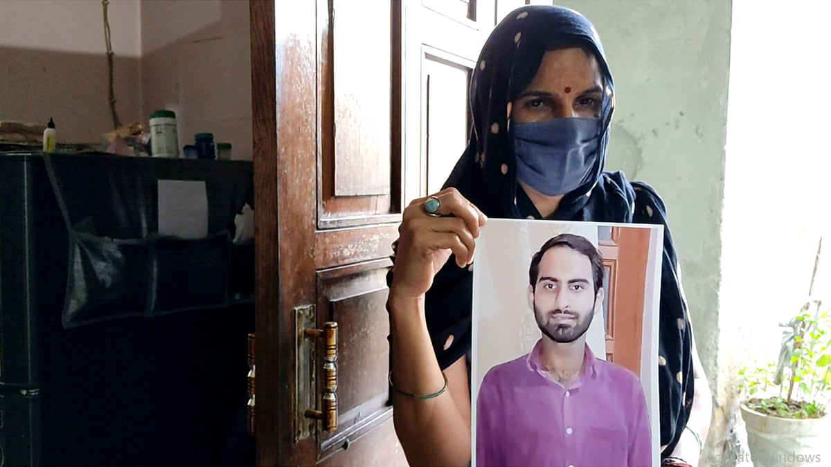 Anita Yadav with her son's picture at her home in Gurgaon.