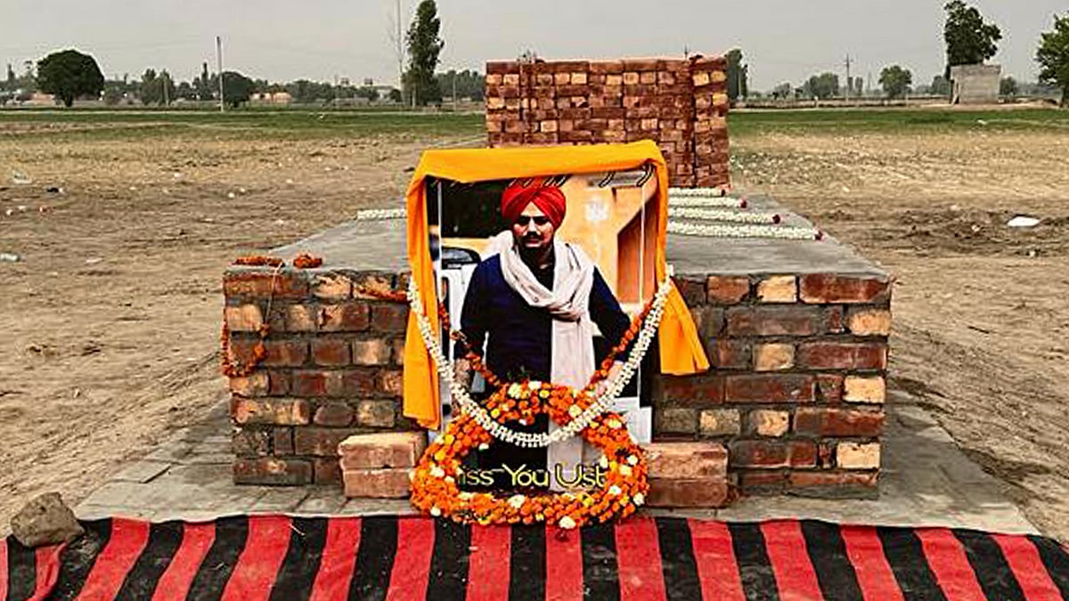 'Miss you Ustad,' reads the poster placed on a field in Moosa village in Mansa.