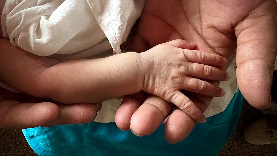 When asked what her newborn has been named, Abbem smiles and says, 'Lan-Ngambi', loosely translated to ‘victorious in a war’.