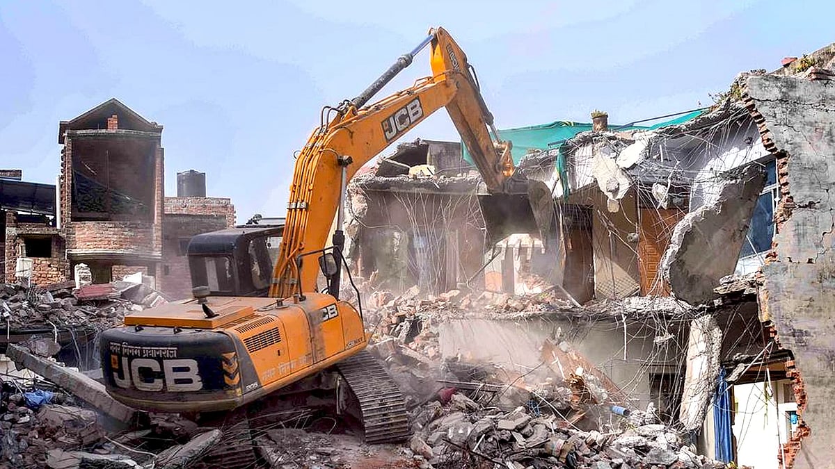 A bulldozer razing structures in Uttar Pradesh last year.