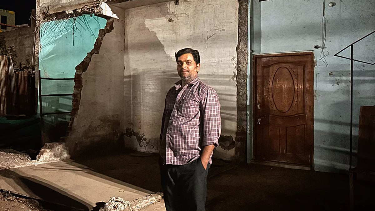 Nadeem Sheikh, standing in front of his demolished bakery at Khargone in Madhya Pradesh.
