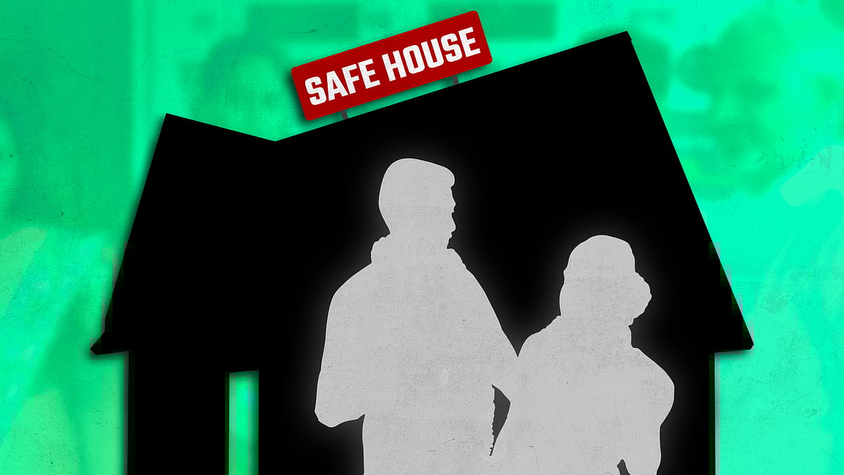 Silhouette of a safe house with a couple standing in front of it. 
