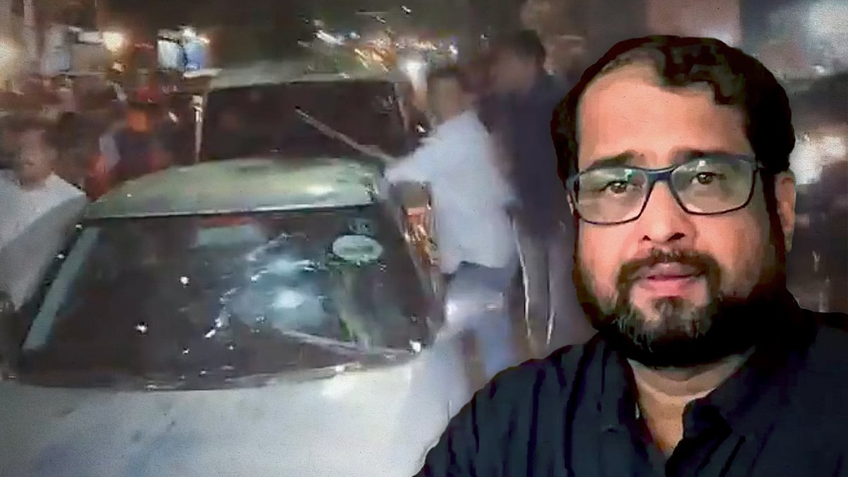 Nikhil Wagle with a picture of his vehicle being attacked.