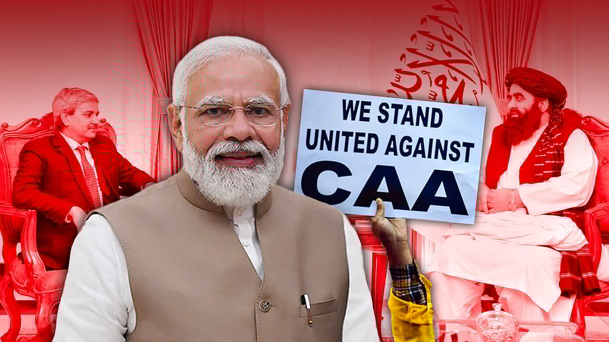 Modi with a CAA protest poster. In the background is JP Singh with Amir Khan Muttaqi.