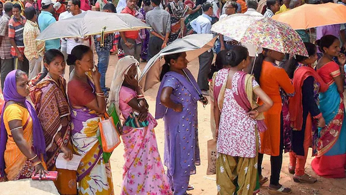 Image of women queueing to vote.