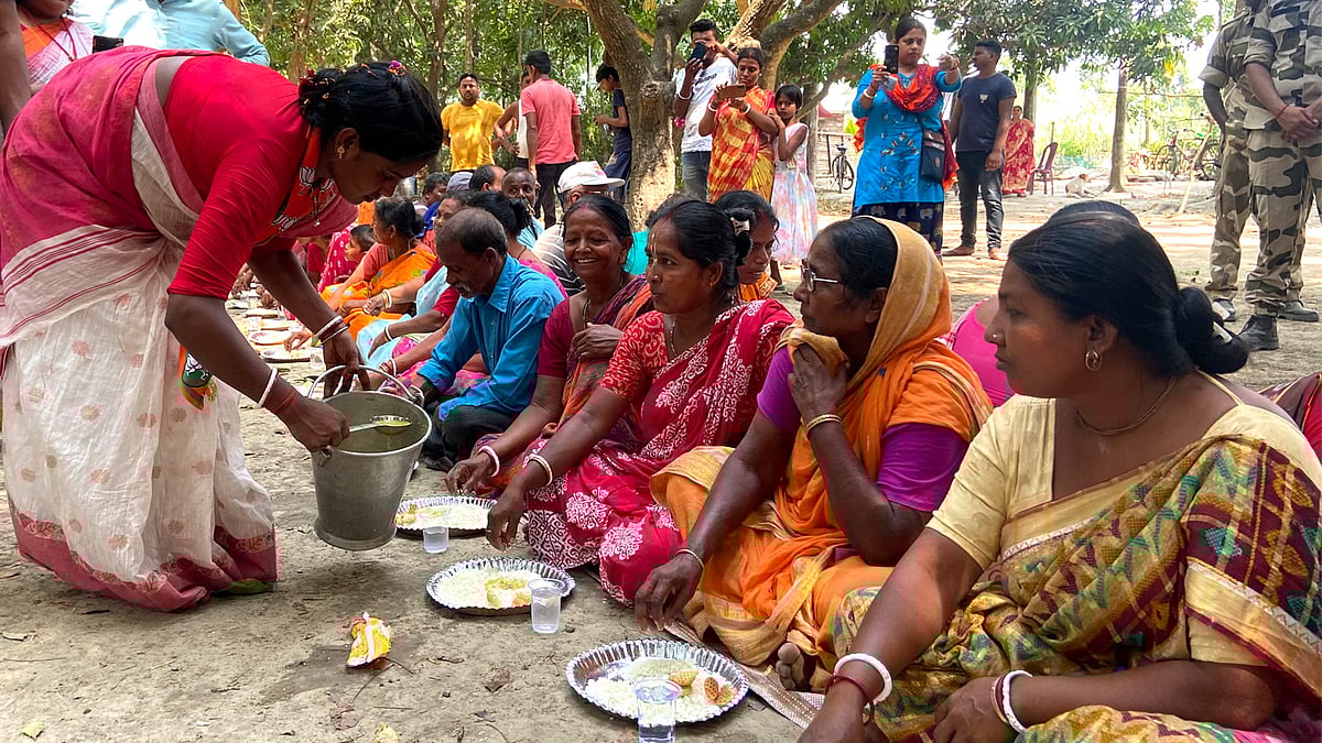 Sandeshkhali violence survivor and BJP candidate Rekha Patra serving lunch to supporters in Basirhat.