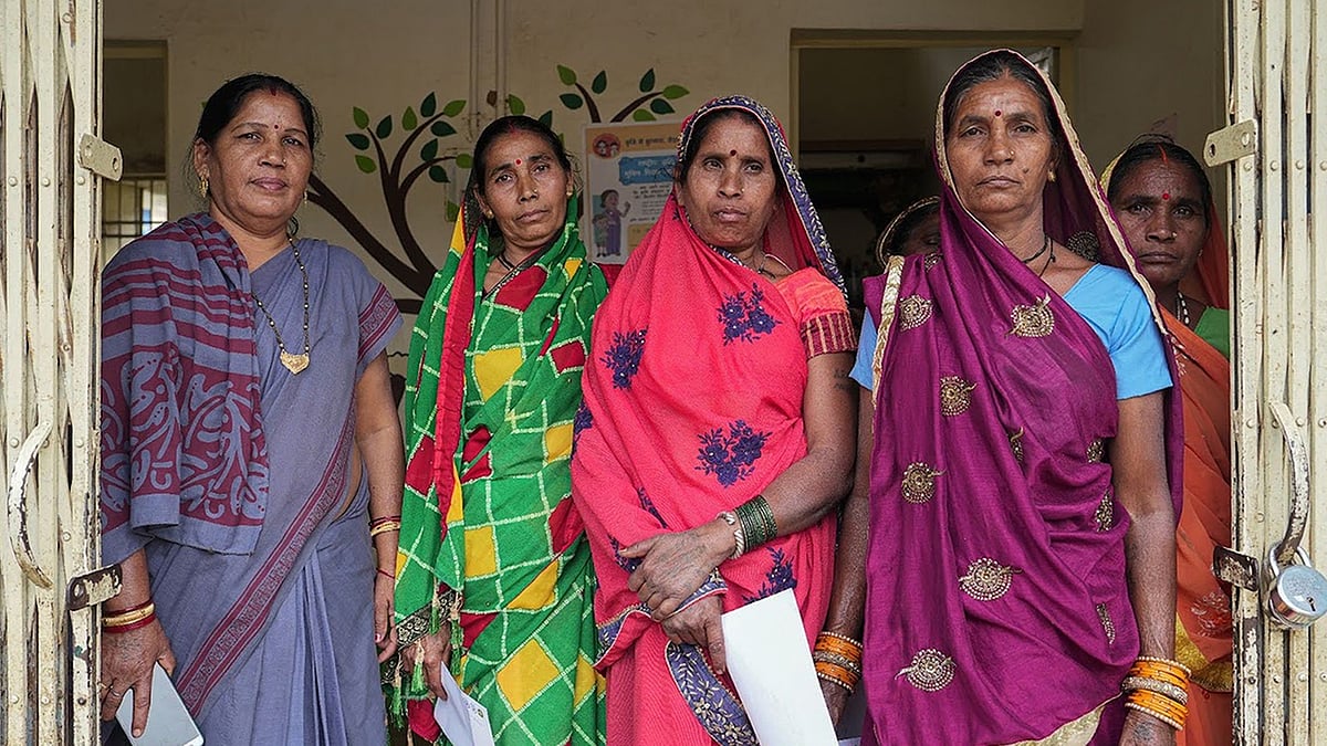 Women from Nayagaon village with an ANM worker gathered for a cancer screening camp by BALCO Medical Centre near Raipur.