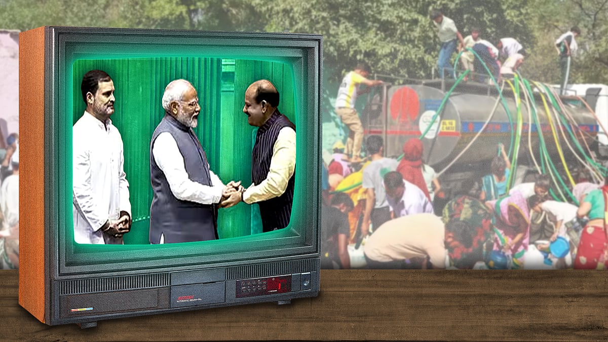 A TV screen showing Narendra Modi and Rahul Gandhi meeting Om Birla.