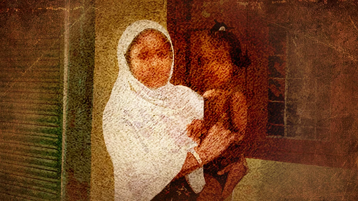 Image of a migrant woman in Kerala holding a child. 
