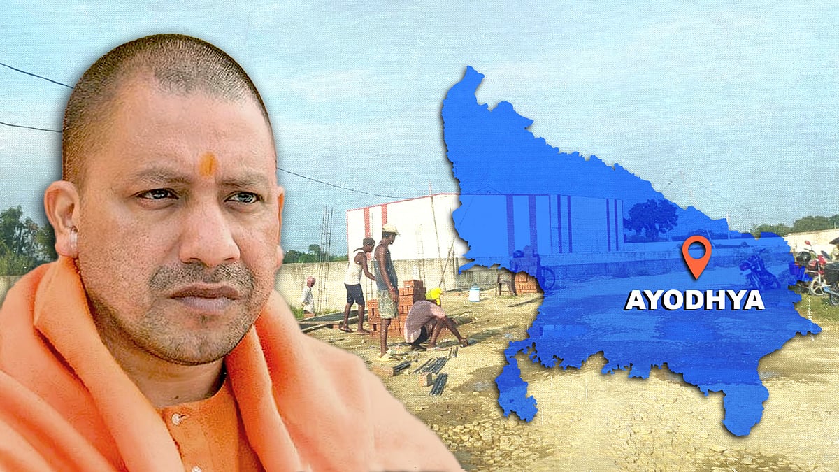Yogi Adityanath with a map of Uttar Pradesh showing Ayodhya.
