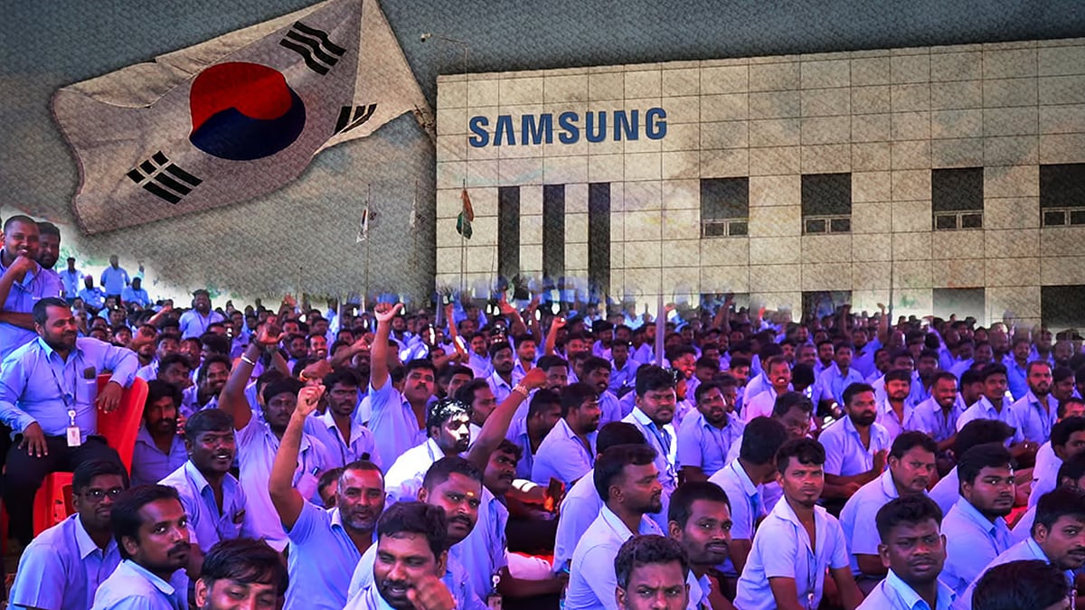 Workers protesting with images of a Samsung factory and the South Korean flag.