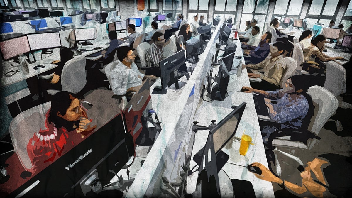 Representational image of an office with employees sitting at computers. 