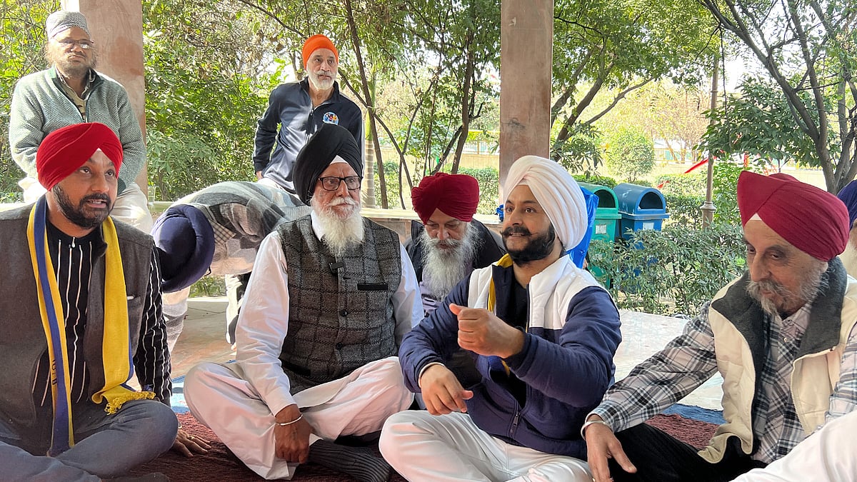 AAP MLA Jarnail Singh with locals in Tilak Nagar.