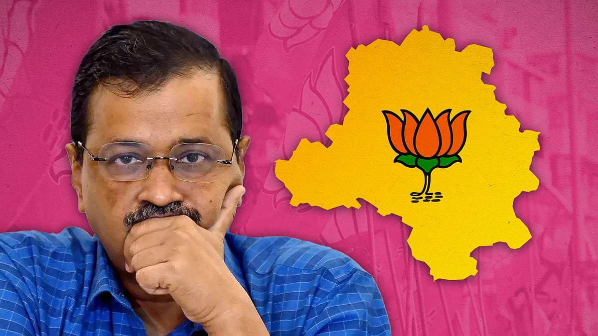 Arvind Kejriwal with a map of Delhi with a lotus symbol.