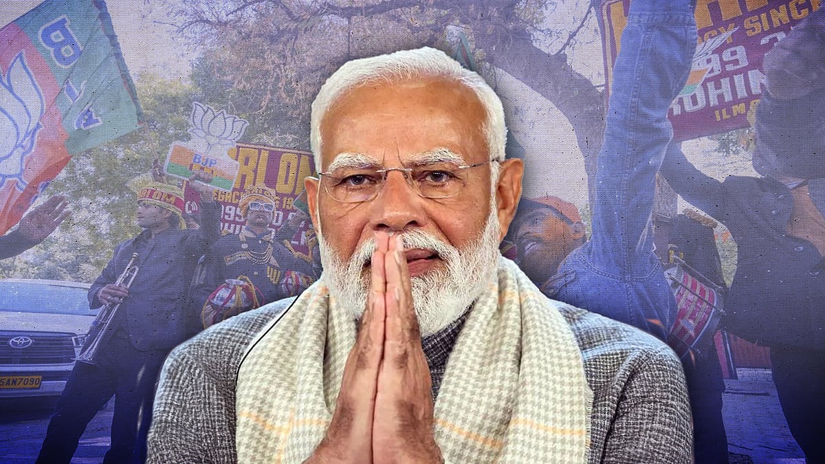 Narendra Modi with a photo of BJP workers celebrating in Delhi. 