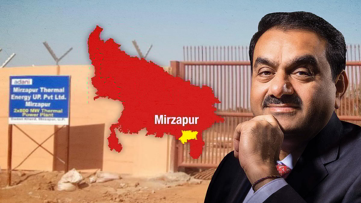 The boundary wall constructed on the site, with Adani and a Mirzapur map. 