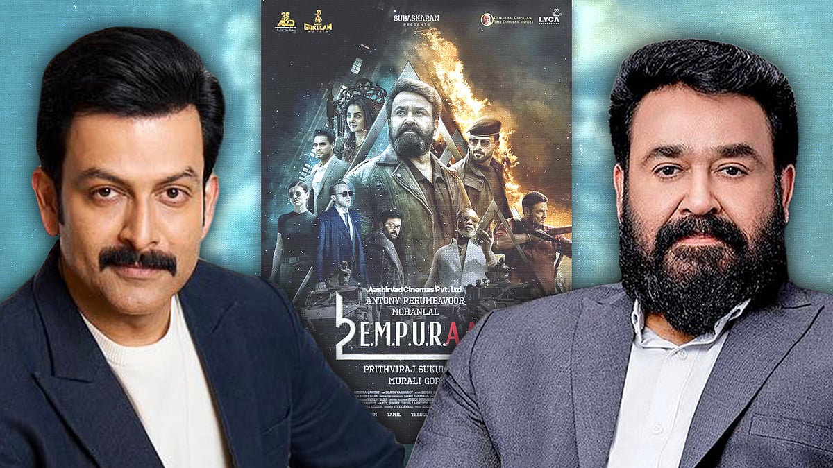 Prithviraj and Mohanlal with the Empuraan movie poster.
