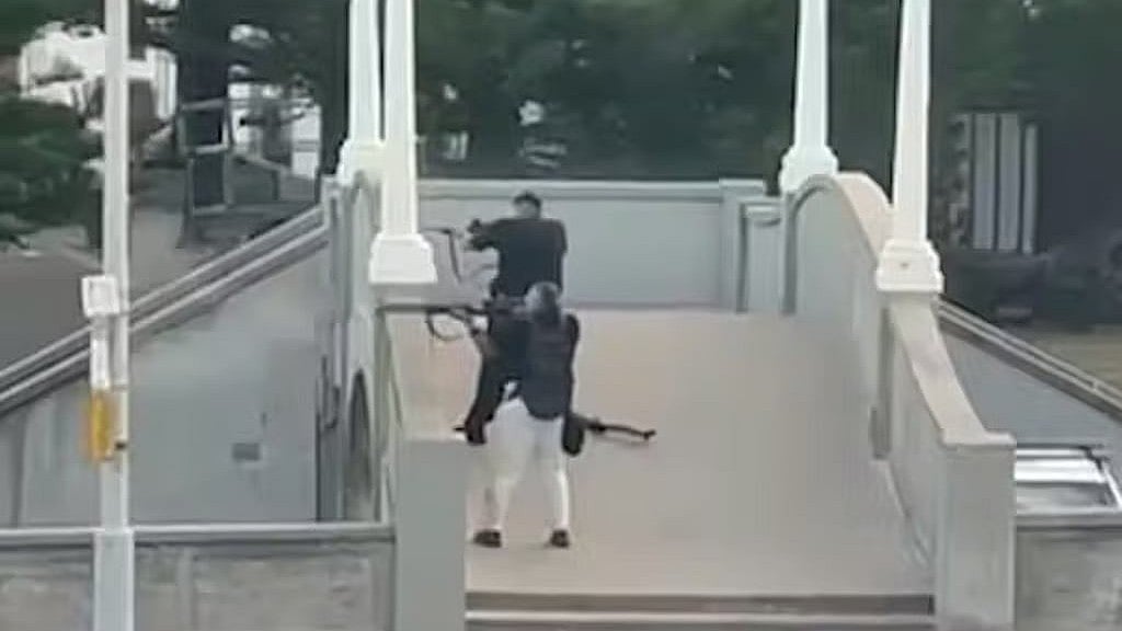 Footage shows the two gunmen beginning their attack from the bridge.