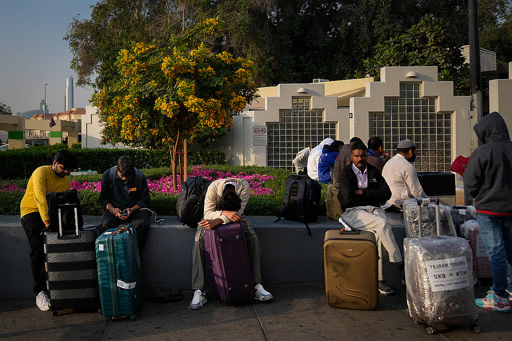 Passengers stranded by the closure of Dubai International Airport on March 1, 2026. (Altaf Qadri/Associated Press)