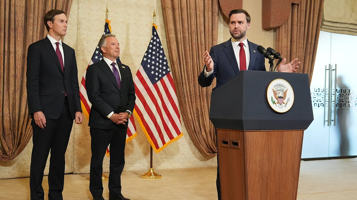 US Vice President JD Vance, right, speaks during a news conference.