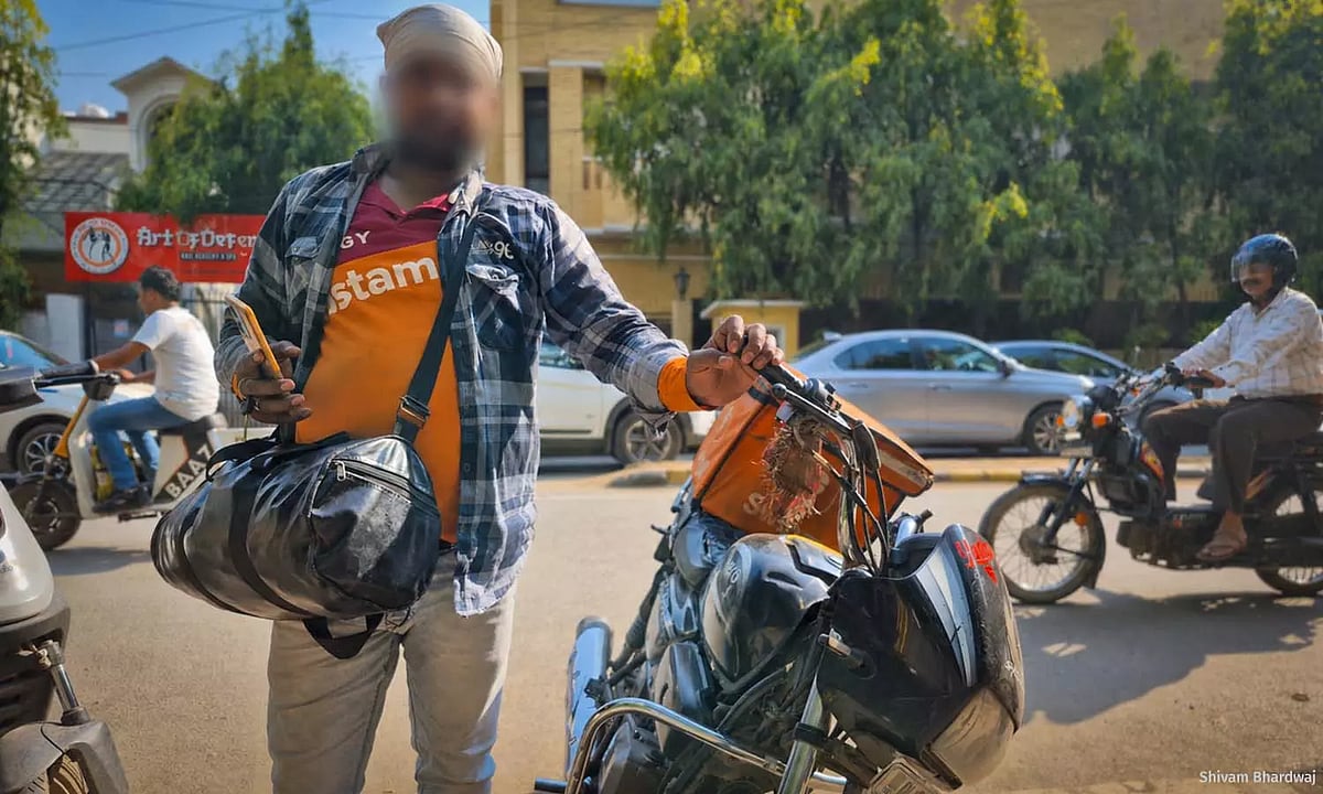 Rakesh Sahu delivers for Swiggy in Delhi. 