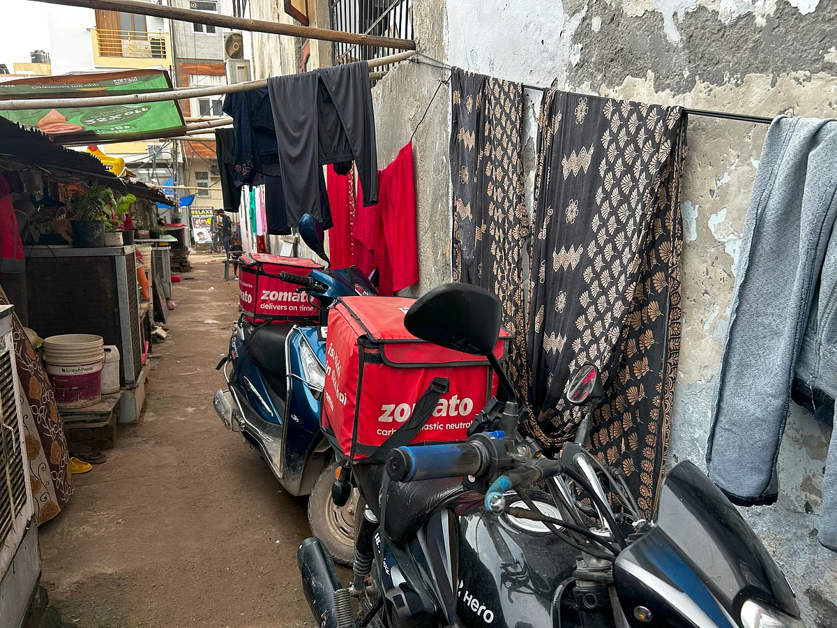 Zomato baskets on top of bikes of the migrant gig workers.