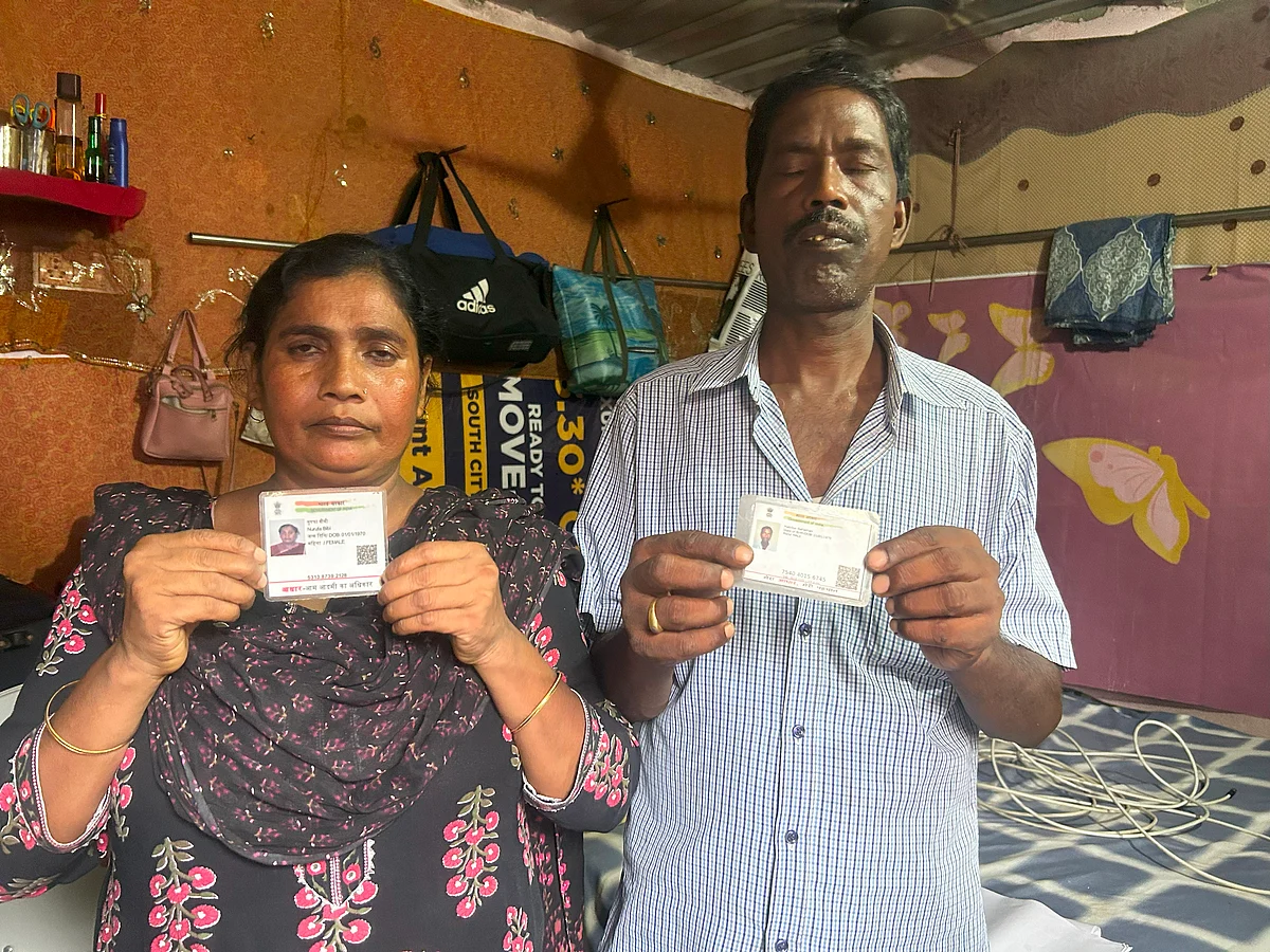 Nurufa Bibi and her husband with their Aadhaar card.