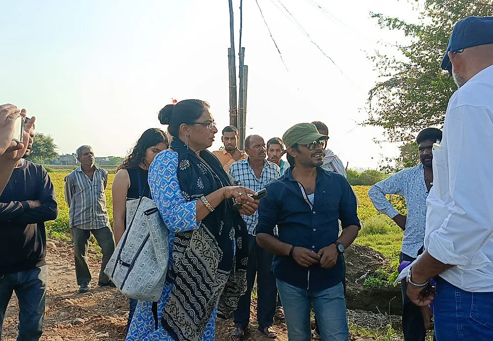 Saurabh Banarjee (in blue shirt) along with villagers and lawyers during a legal consultation trip.