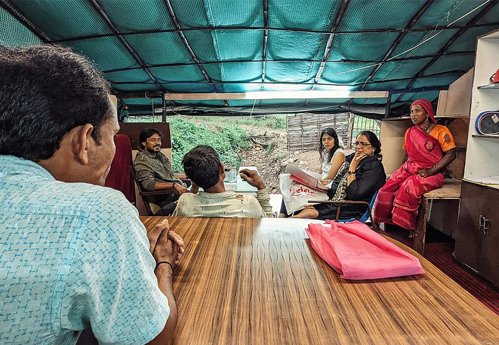 Villagers talking to lawyers during a legal consultation session organised by HOWL.
