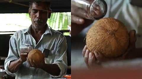 ബാലകൃഷ്ണൻ ചില്ല് ഗ്ലാസ് ഉപയോഗിച്ച് തേങ്ങ പൊട്ടിക്കുന്നതിൻ്റെ ചിത്രങ്ങൾ