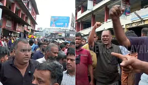 കല്ലുത്താന്‍ കടവിലെ പുതിയ കെട്ടിടത്തിലേക്ക് മാറാന്‍ തയ്യാറല്ല; കരിദിനം ആചരിച്ചും മനുഷ്യച്ചങ്ങല തീര്‍ത്തും പ്രതിഷേധിച്ച് വ്യാപാരികള്‍