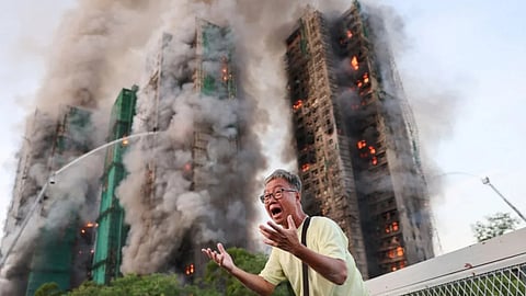 fire spread across seven apartment buildings in a Hong Kong