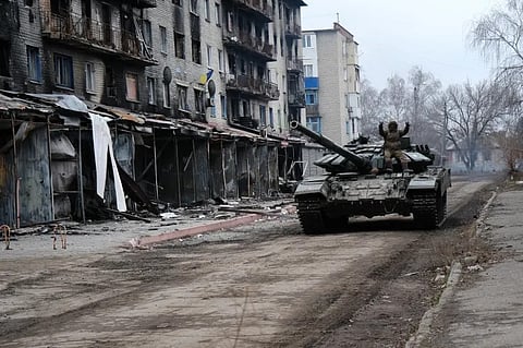 A Ukrainian tank drives on street