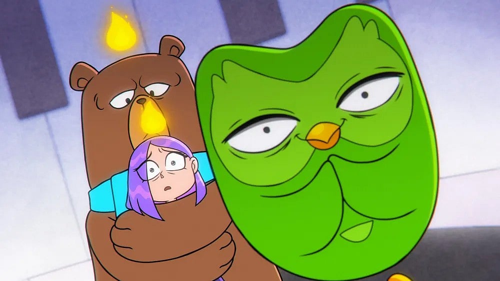 Worried purple-haired girl held by a bear as a mischievous green owl loom in front of them.