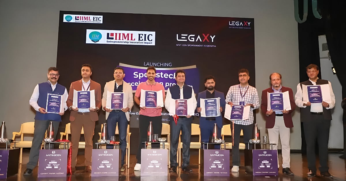 LegaXy and IIM Lucknow EIC officials launch India’s first Sportstech and Gaming Accelerator program on stage, holding event brochures during the announcement ceremony
