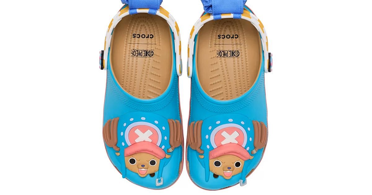 One Piece x Crocs Tony Tony Chopper Classic Clog in blue with Chopper's face on the upper, yellow and white striped back strap, and blue pouch