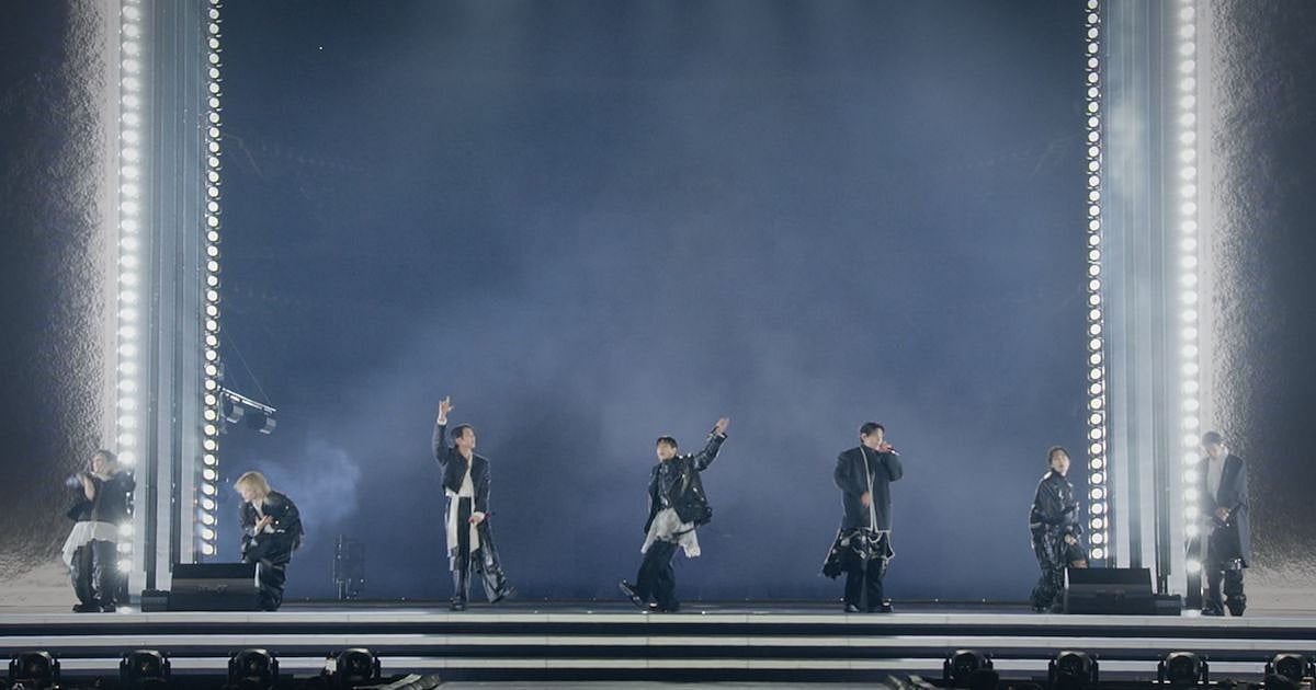 BTS performs on an open cube stage with vertical light columns during the Arirang comeback concert at Gwanghwamun Square in Seoul on March 21, 2026
