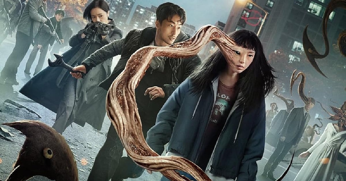 An action-packed promotional still from Parasyte: The Grey, showcasing the protagonist with a parasitic organism emerging from her face alongside characters prepared for combat in a gritty urban setting.