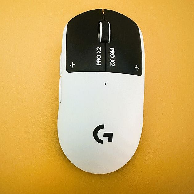Top-down view of Logitech G Pro X2 Superlight gaming mouse in white, showing left and right click buttons labeled PRO X2
