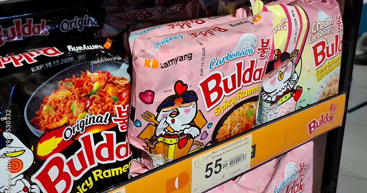 Assorted Samyang Buldak carbonara and original flavor spicy ramen instant noodle packets on supermarket retail display shelf for South Korean food on March 18, 2026 in Bangkok, Thailand.